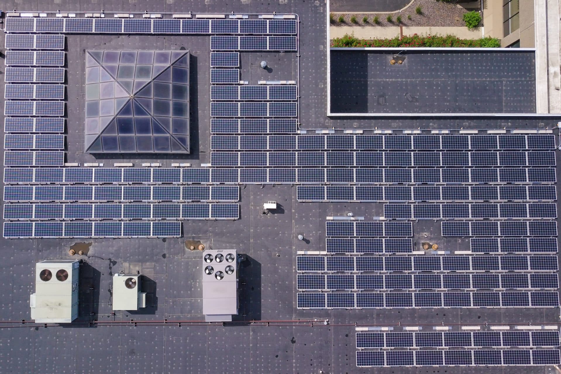 aerial view of rooftop commercial solar panels