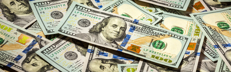 U.S. hundred-dollar bills lay in a pile.